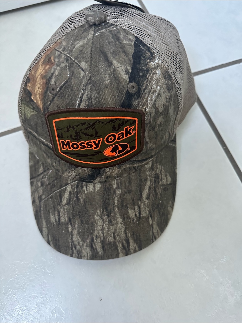 Mossy Oak Camo Trucker Hat with Orange Logo Patch